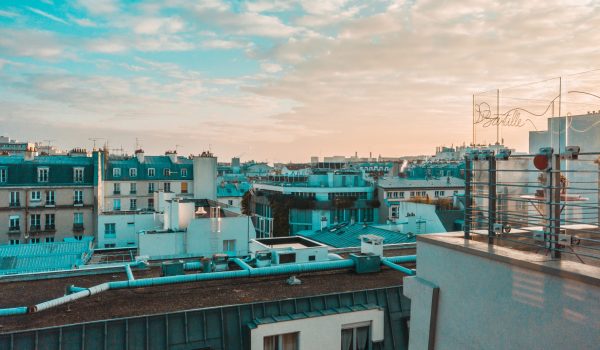 city buildings under cirrus clouds